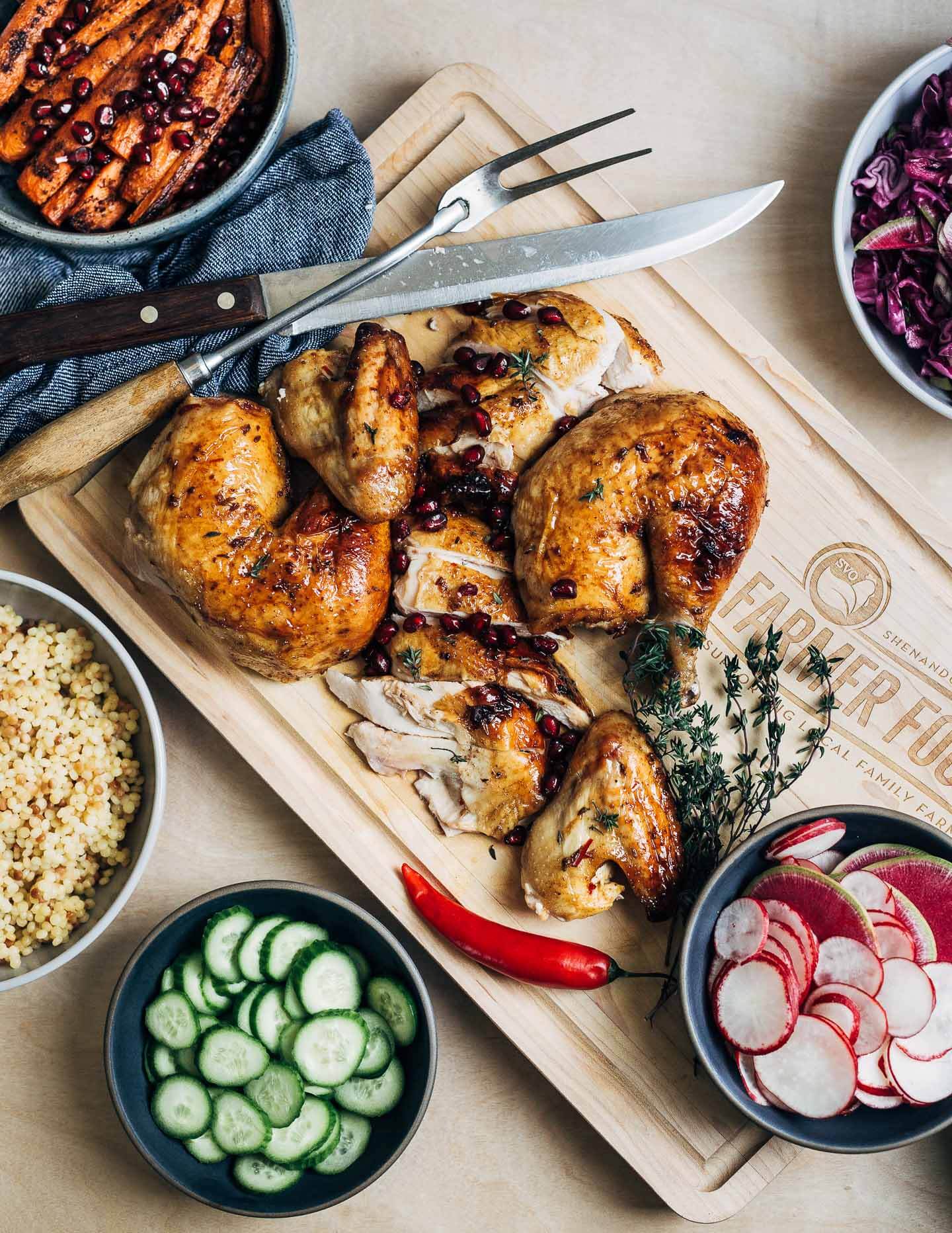 Make a Christmas feast to remember with this sumptuously flavored pomegranate-glazed roasted chicken and a host of colorful sides.