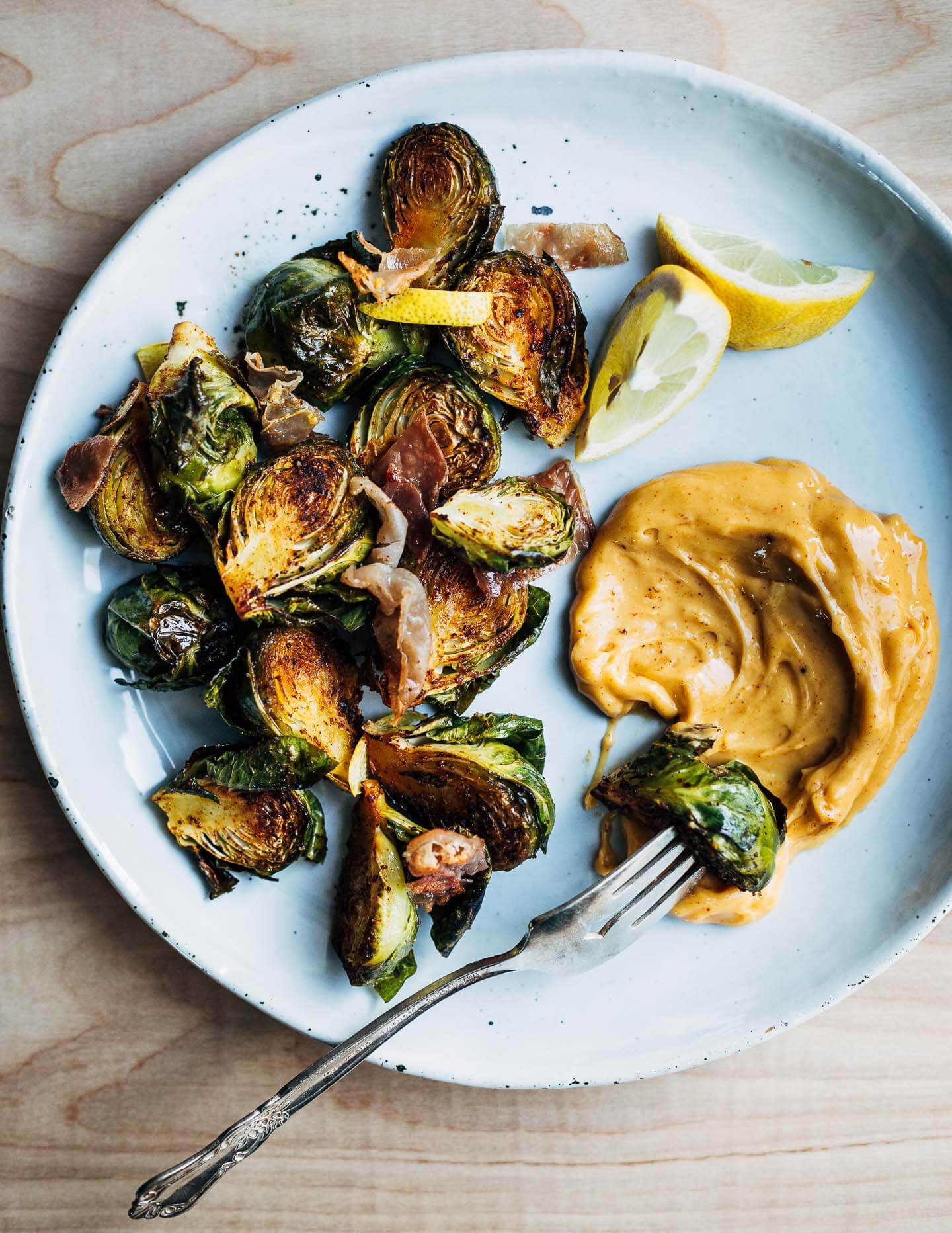 Paprika roasted Brussels sprouts served with crispy prosciutto and smoky, rich pimentón aioli are lovely served as a shared small plate or a dinnertime side. 