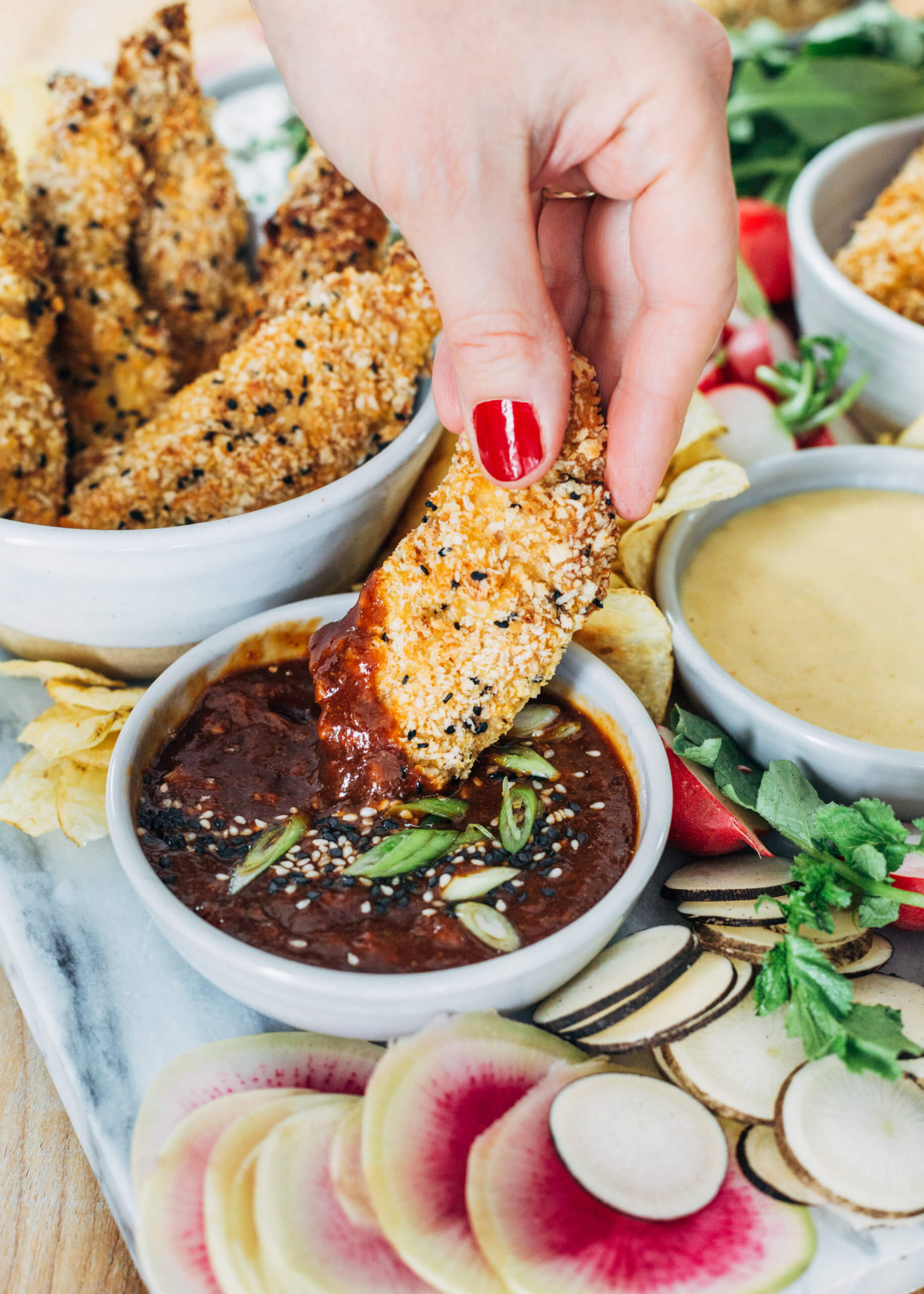 Sesame-ginger baked tenders with a sweet and sour dipping sauce. 