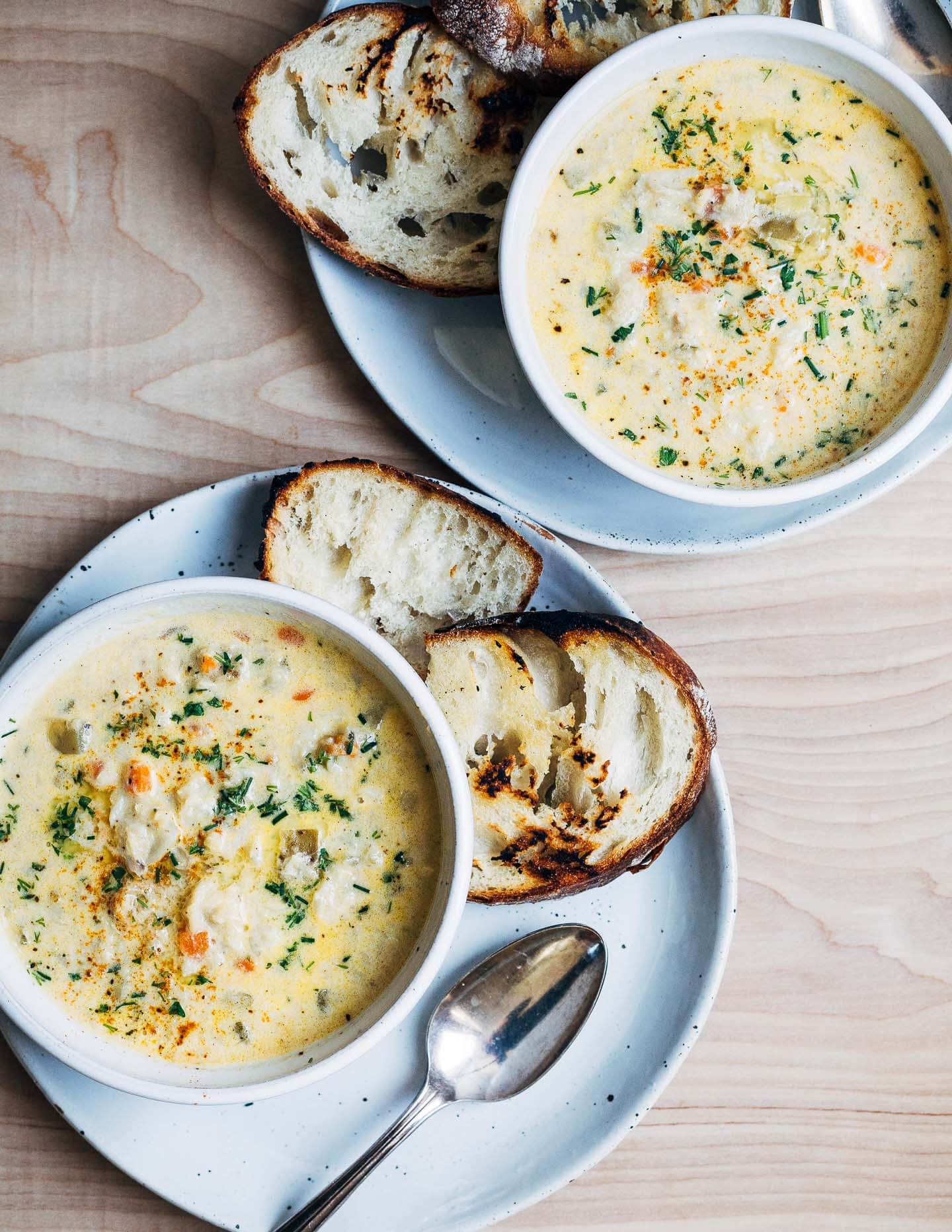 A rich and creamy seafood chowder recipe featuring cod, crab, a mix of potatoes and turnips, and wild chives. 