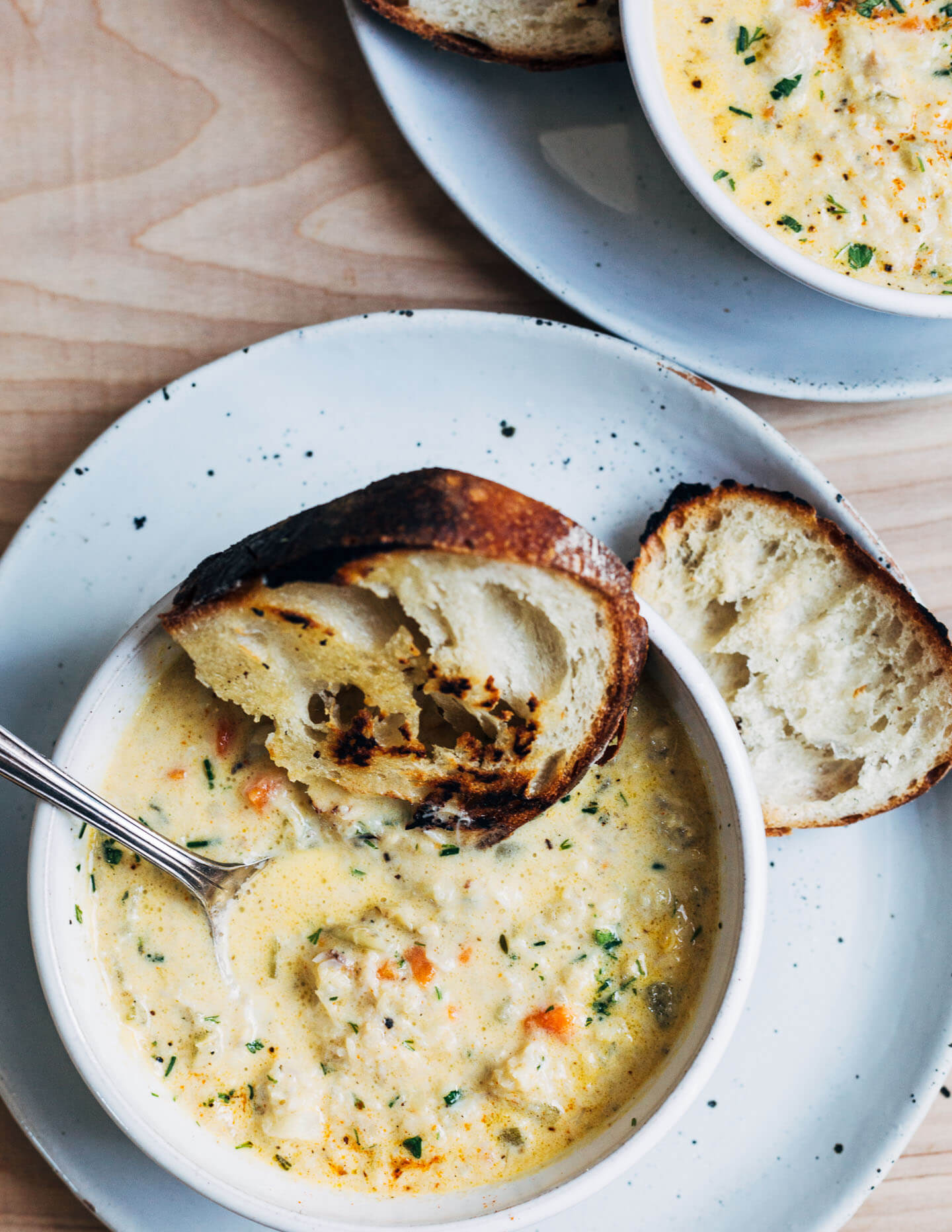 A rich and creamy seafood chowder recipe featuring cod, crab, a mix of potatoes and turnips, and wild chives. 