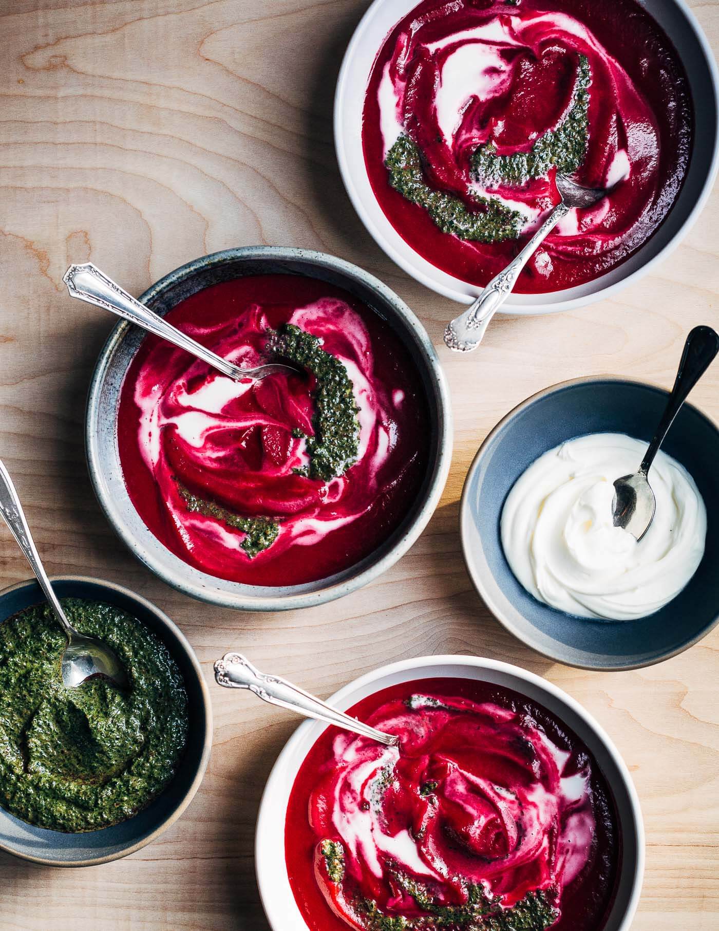 A vibrant root-to-leaf beet soup recipe that's swirled with crème fraîche and beet green pistou. Colorful, earthy, and wonderfully savory, this beet soup is an early spring delight.
