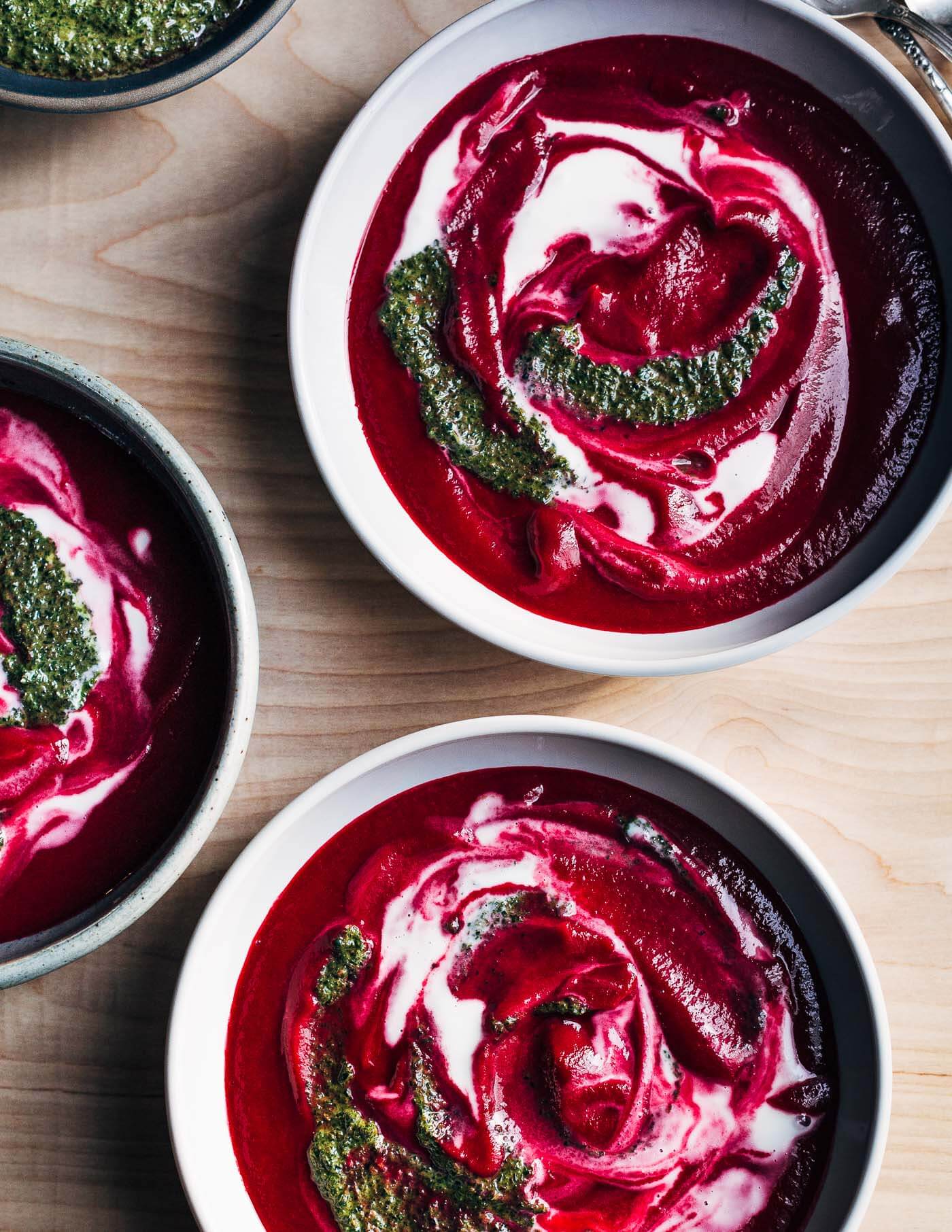 A vibrant root-to-leaf beet soup recipe that's swirled with crème fraîche and beet green pistou. Colorful, earthy, and wonderfully savory, this beet soup is an early spring delight.