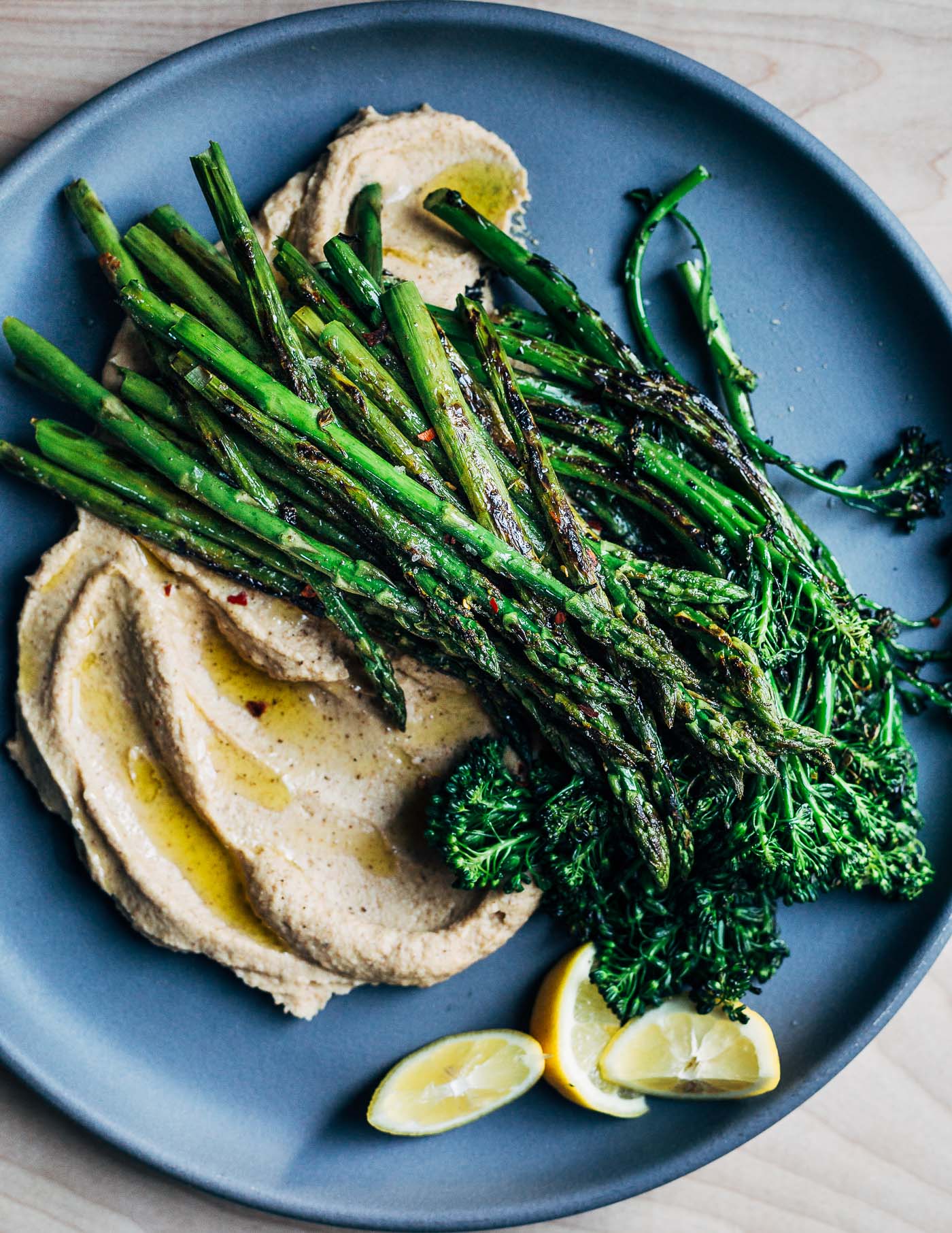 A big plate of vegetables with incredible depth of flavor, this roasted garlic and cauliflower puree topped with sautéed asparagus and broccolini perfectly captures the shifting spring season.