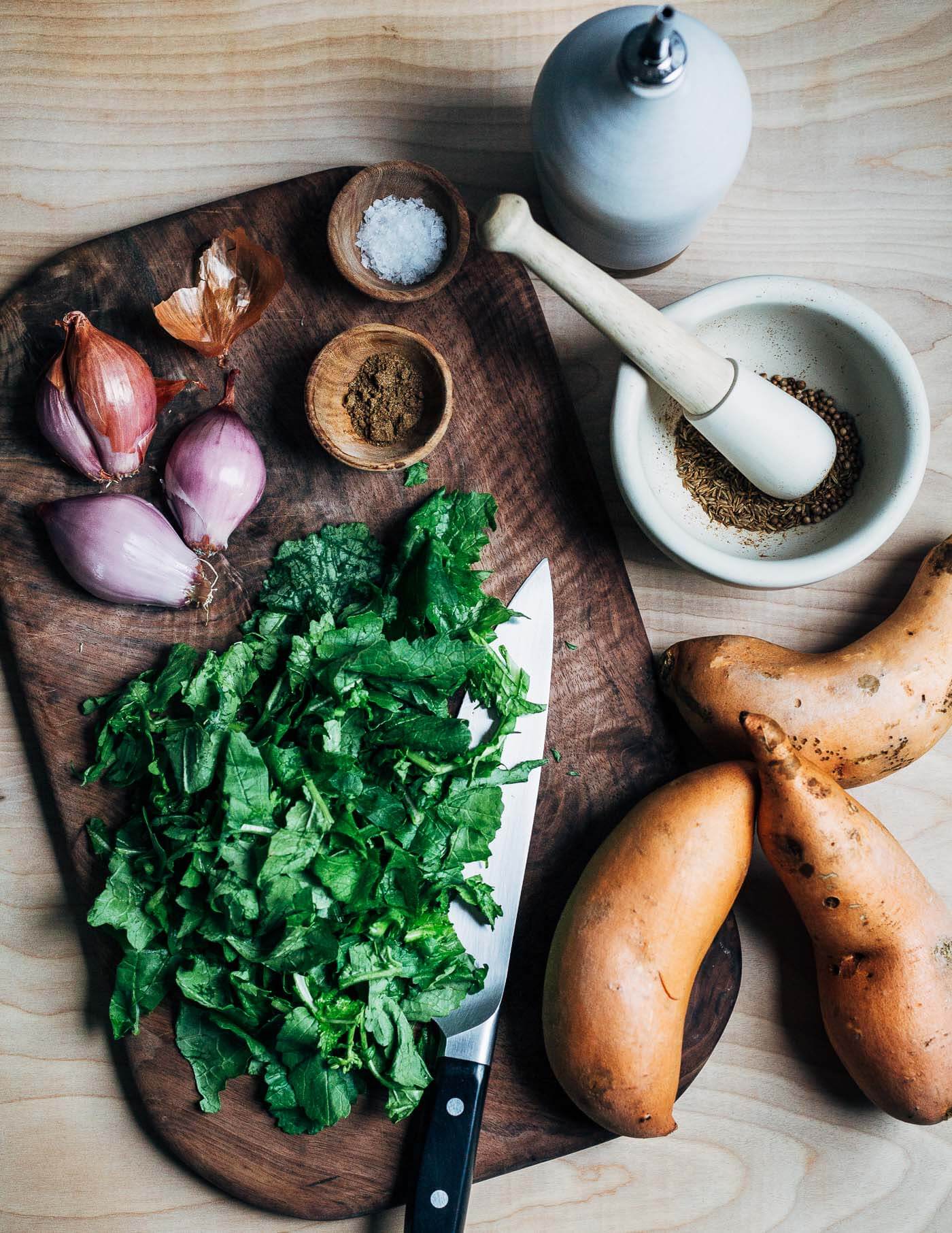 Ingredients for roasted sweet potatoes with braised greens. 