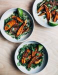 A simple approach to meltingly delicious cooked greens featuring spiced roasted sweet potato wedges and tender coconut milk braised greens with just a bit of heat. 