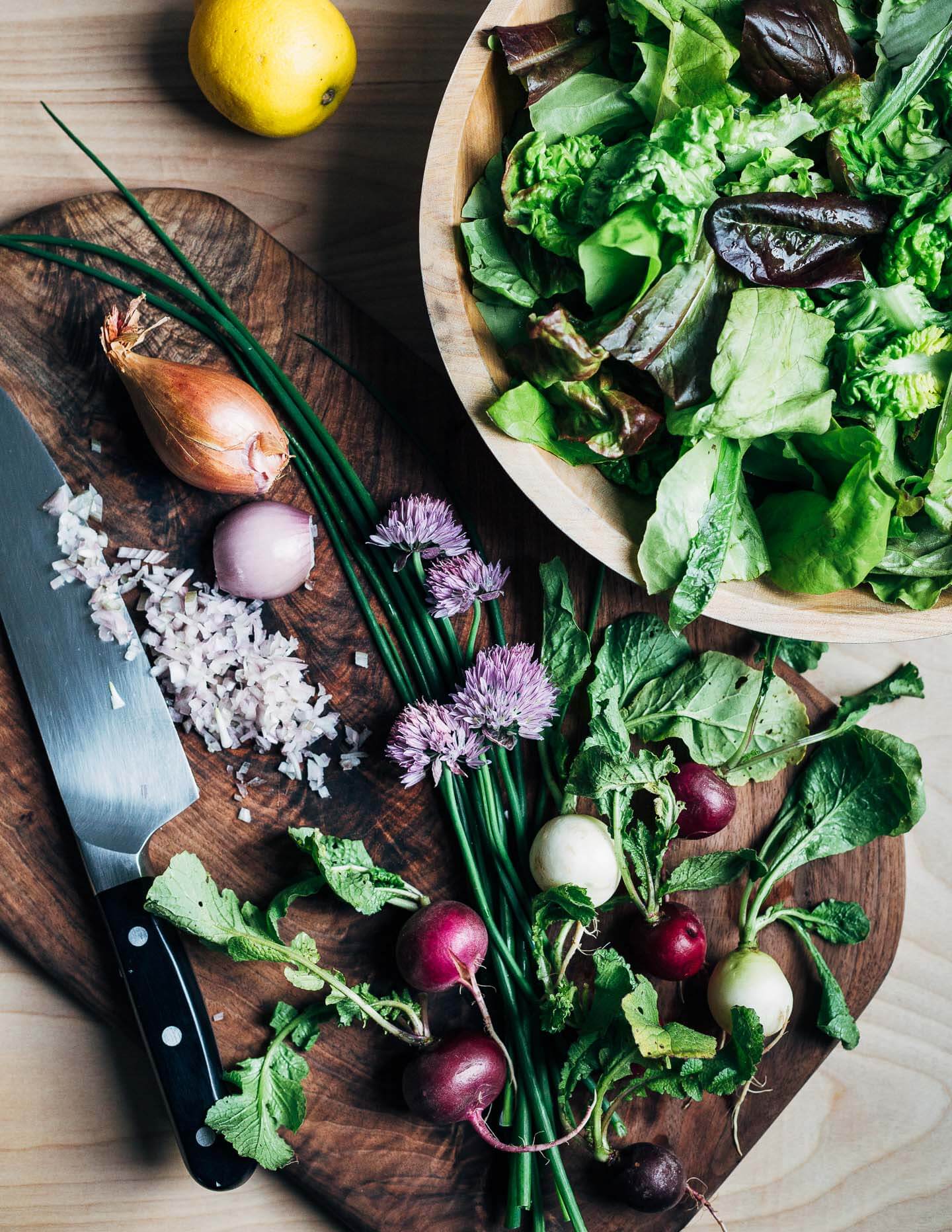 Ingredients for a green salad and a classic vinaigrette with shallots, lemon, and chives. 