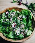 This simple late-spring green salad is inspired by my garden and all the first big burst of seasonal produce. It's made with a variety of delicate lettuces, jewel-toned radishes, and chives.