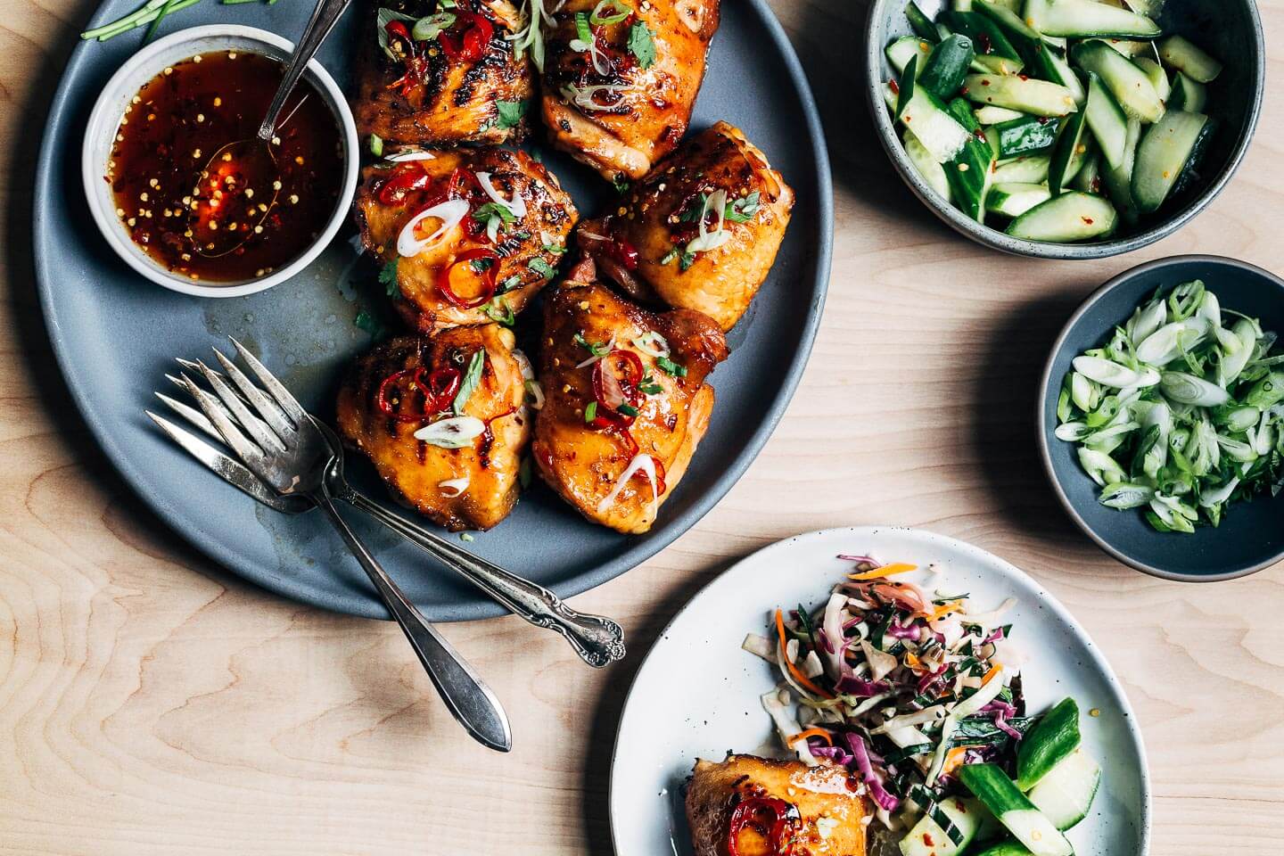 These hot honey grilled chicken thighs have it all – smoky char from the grill, crispy skin that's sticky sweet with a kick of heat, and wonderfully tender, falling off the bone meat.