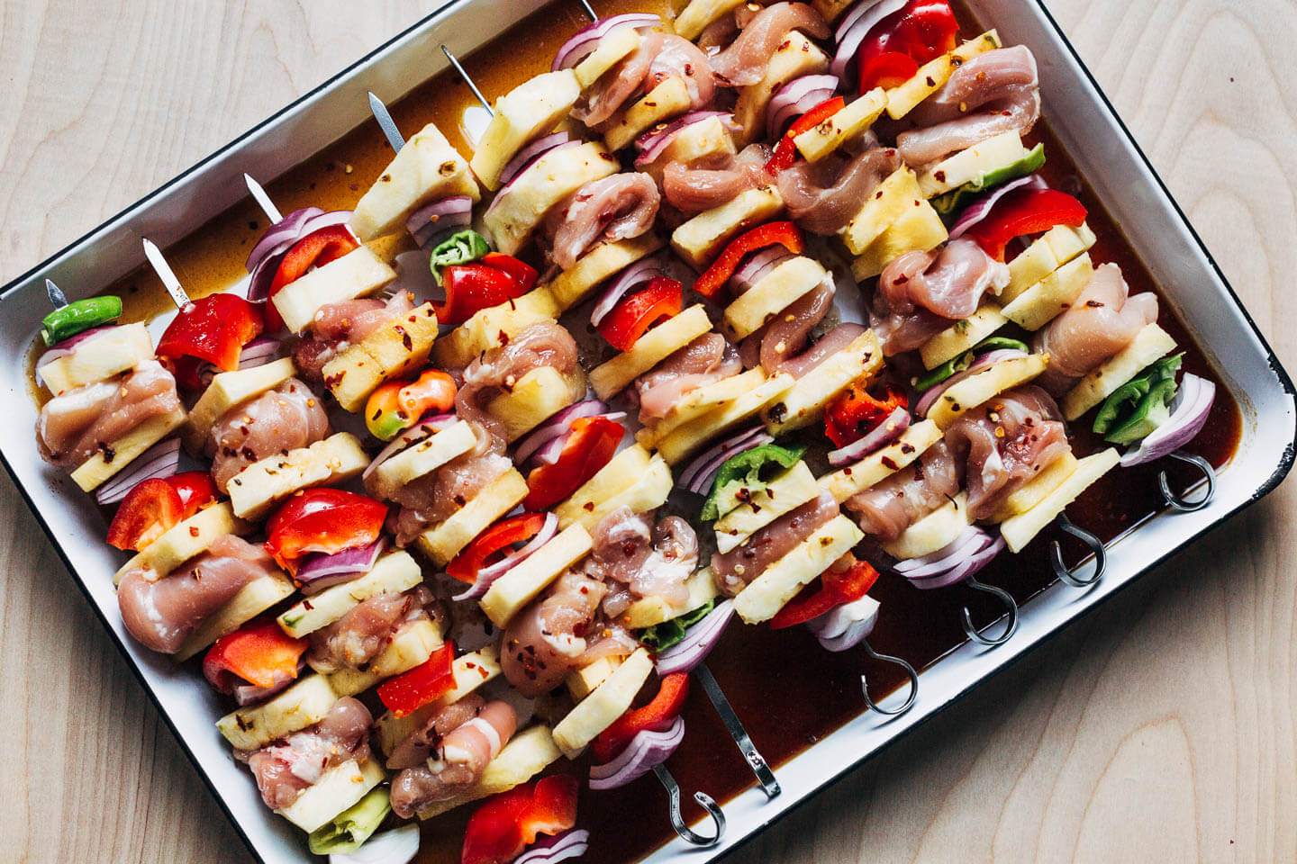 Marinated pineapple chicken kebabs, ready for the grill. 