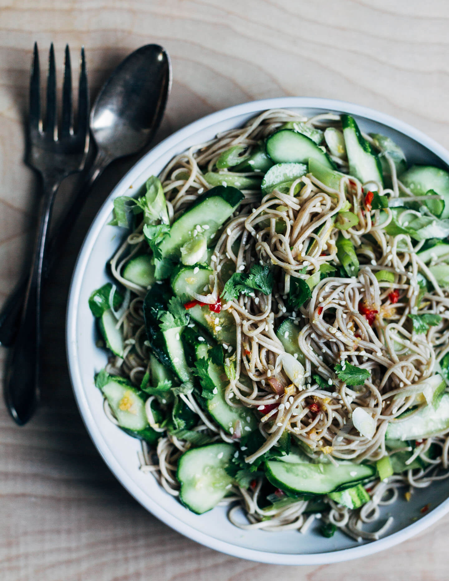 The perfect meal for hot summer days – cold cucumber soba noodles with a sweet chili sauce. Made with nutty buckwheat soba noodles with a super flavorful sweet chili and ginger sauce, quick-pickled cucumbers, and green onions.