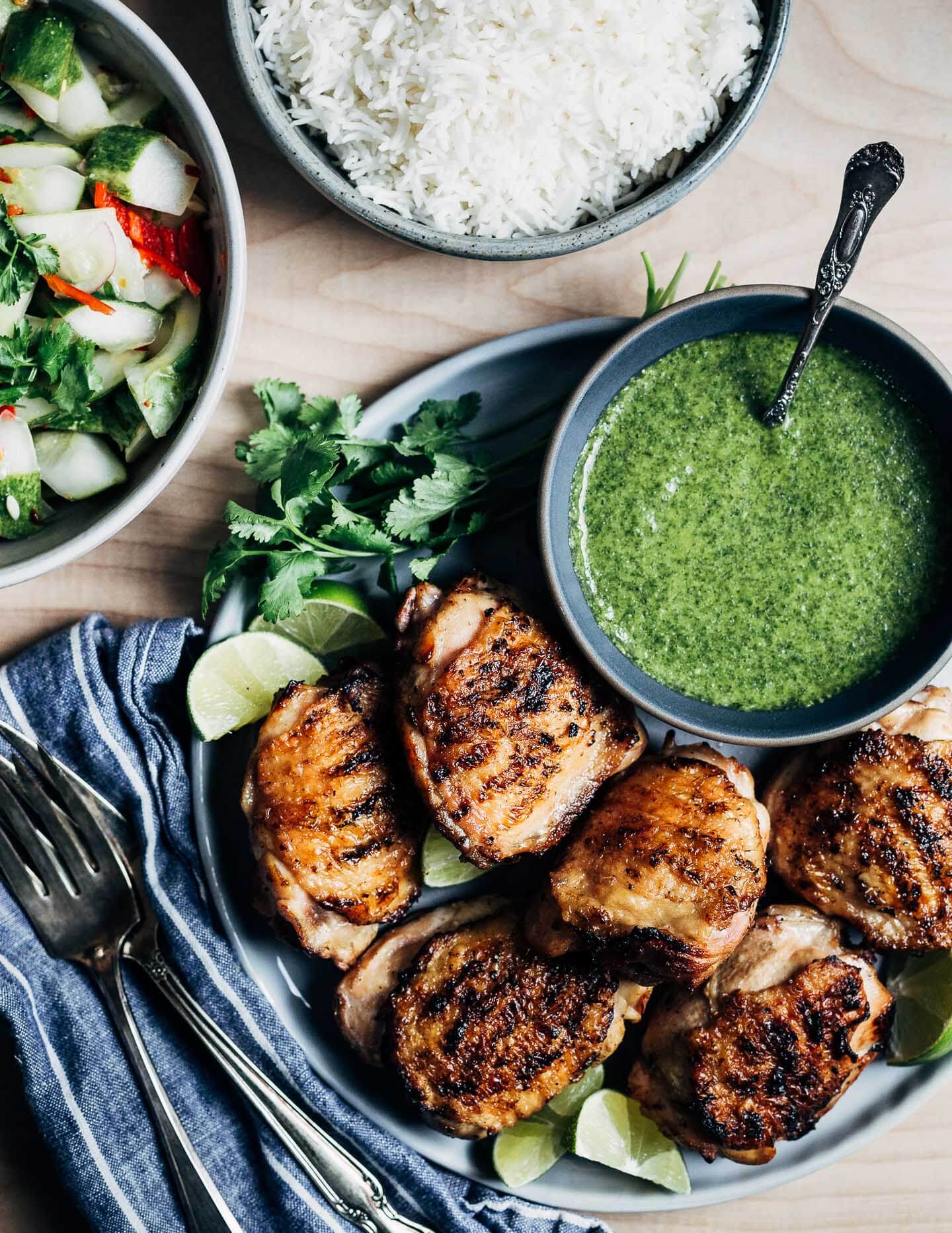 Grilled coconut lime chicken thighs come off the grill with crispy, caramelized skin and just the right amount of tang, sweetness, and spicy heat. Whether you're hosting a Labor Day cookout for neighbors or just your family, you can prep these chicken thighs ahead so all you need to do in the moment is fire up the grill!