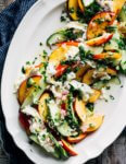 A refreshing savory nectarine and cucumber salad with burrata, green chilies, lemon, and fresh cilantro.