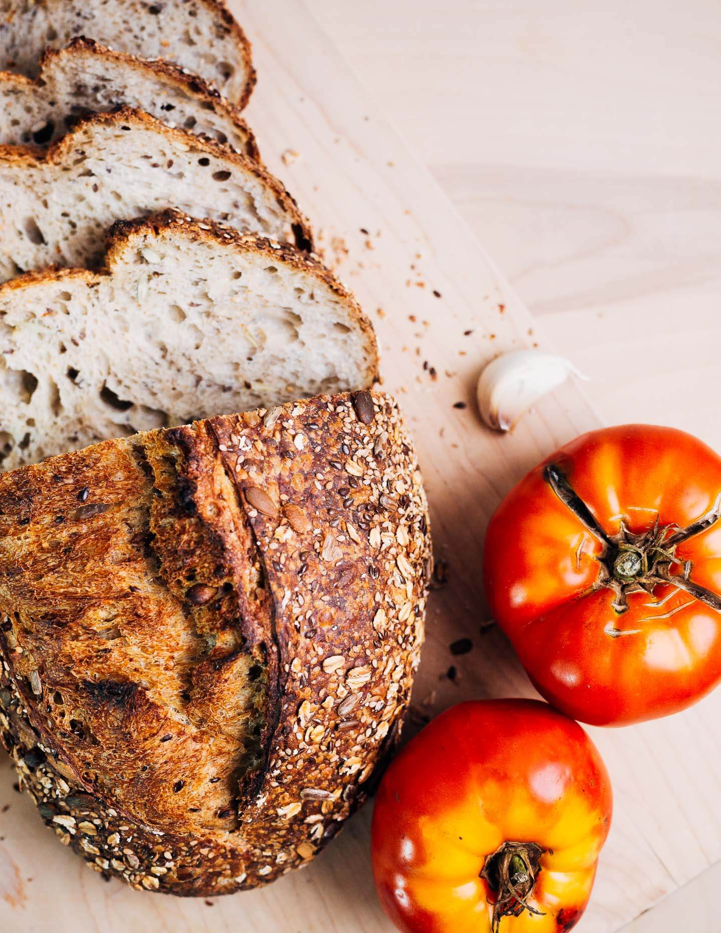 Rustic seeded sourdough and garden tomatoes