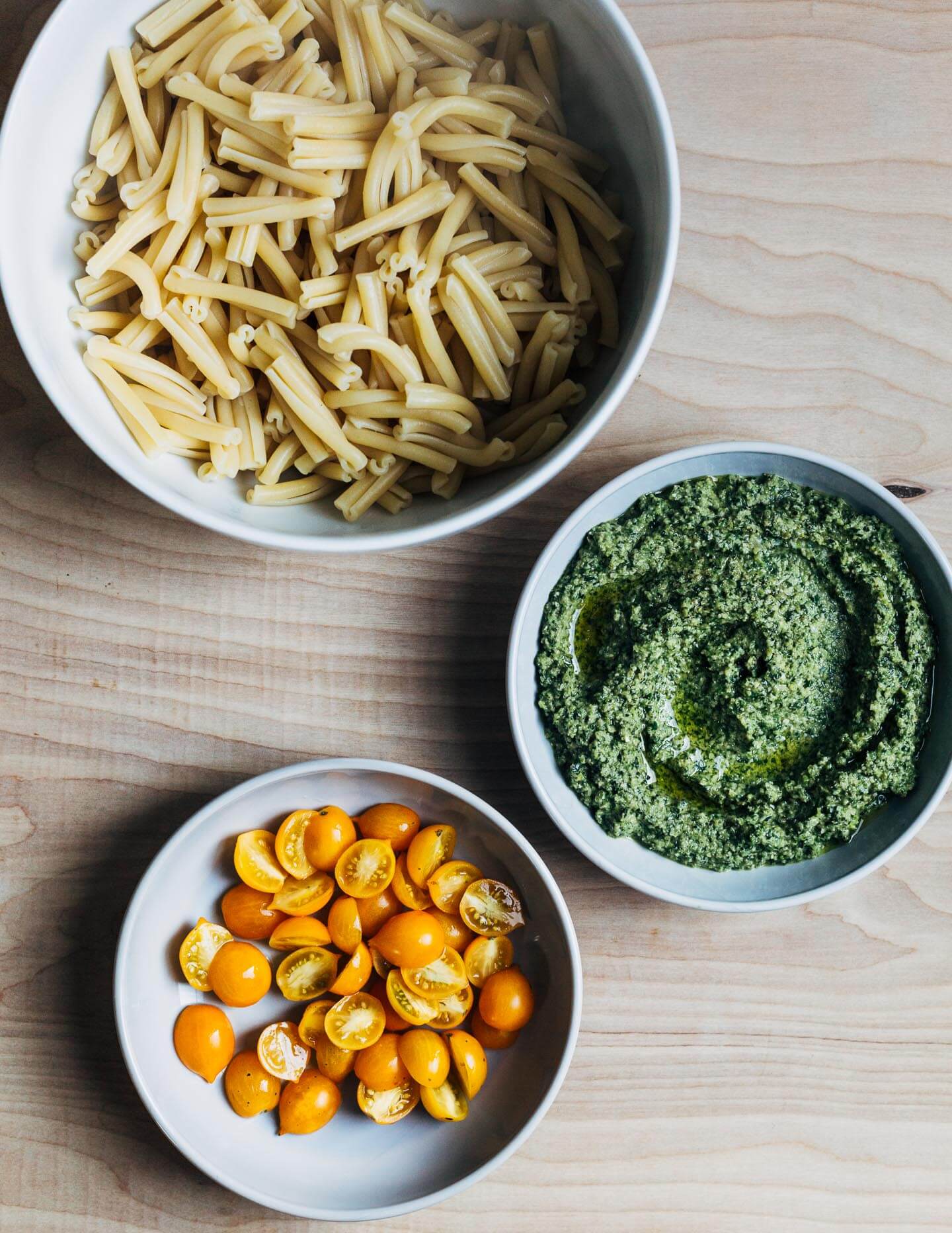 Pasta, pesto, and sun gold tomatoes. 