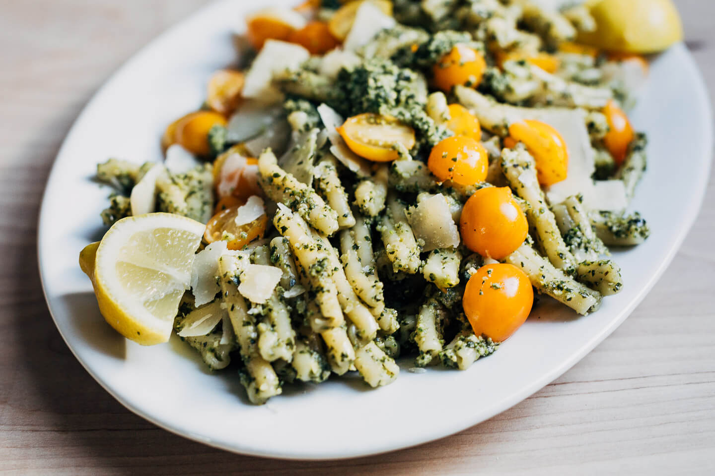 Zucchini pesto served over pasta with Parmesan and sun gold tomatoes. 