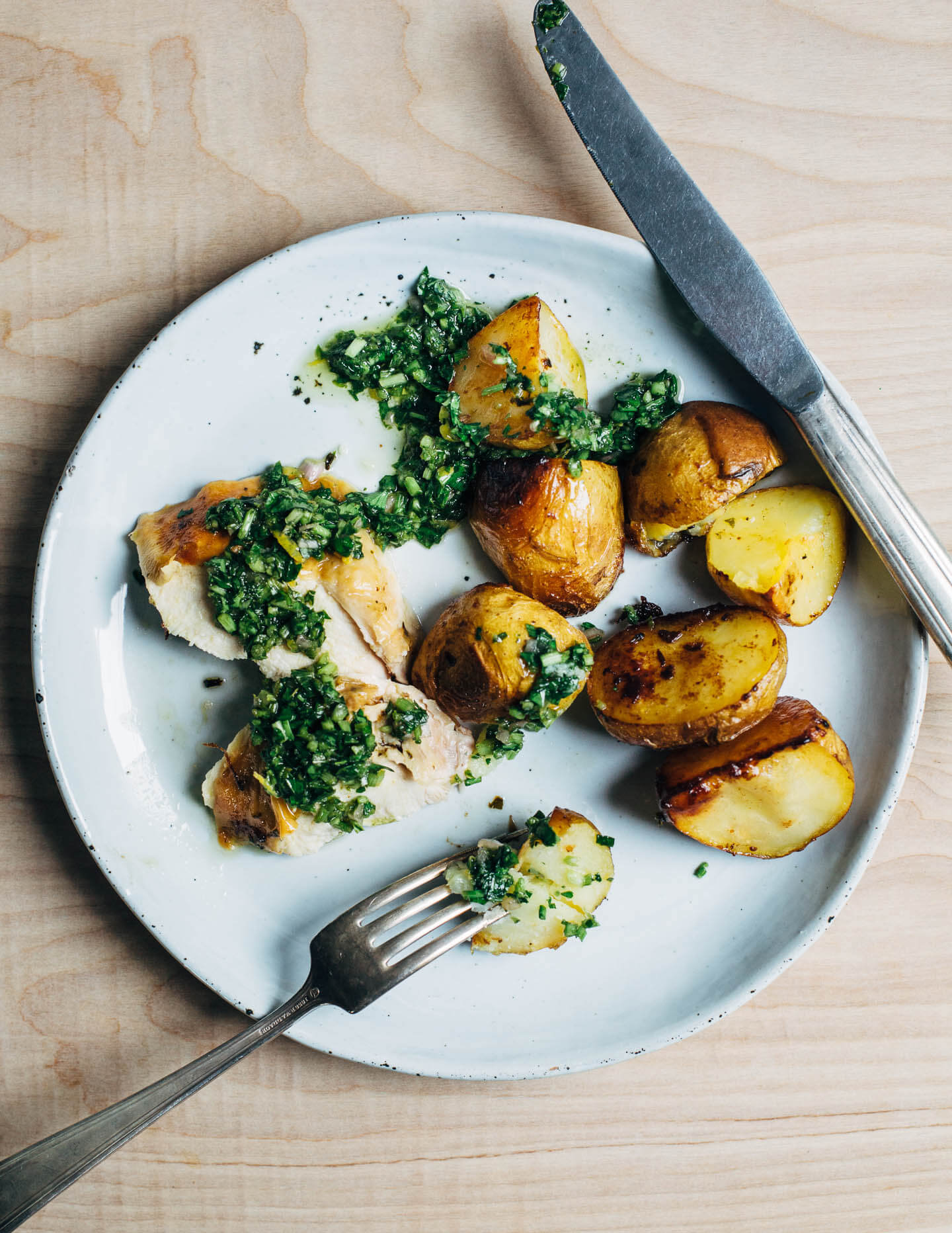 Fall weather means it's the right time to turn on your oven and make this crisp-skinned, deeply flavorful chimichurri roasted chicken with schmaltzy Yukon gold potatoes.
