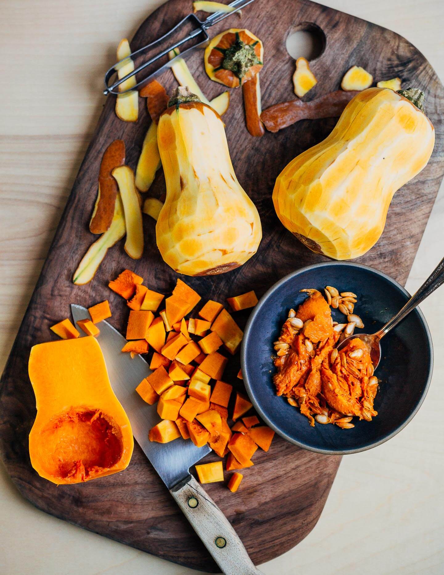 Peeling and chopping Honeynut squash