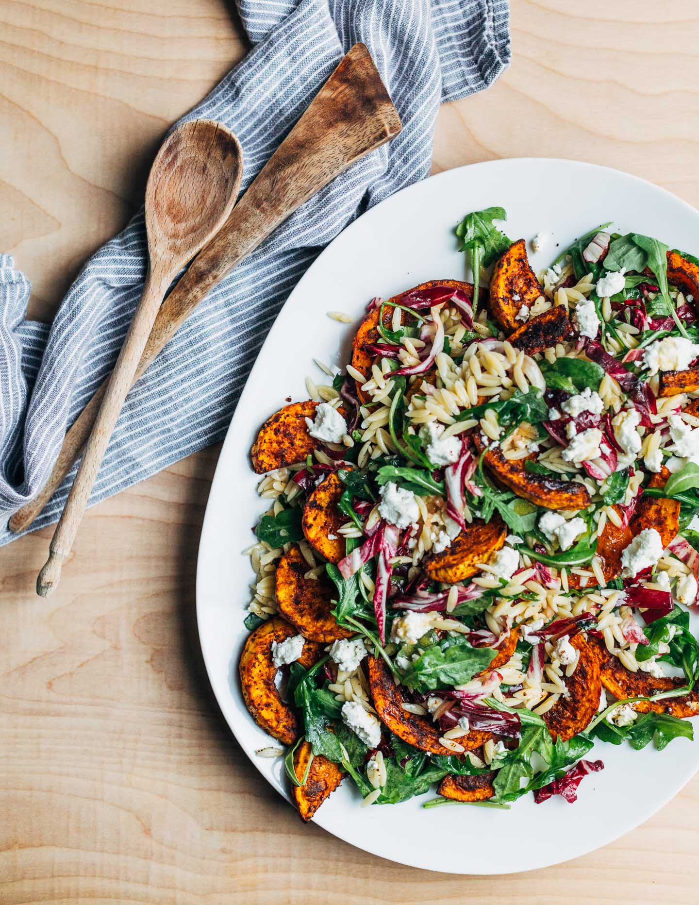 This roasted butternut squash and orzo salad with sturdy fall greens and crumbled goat cheese is beautiful, delicious, and perfectly autumnal.