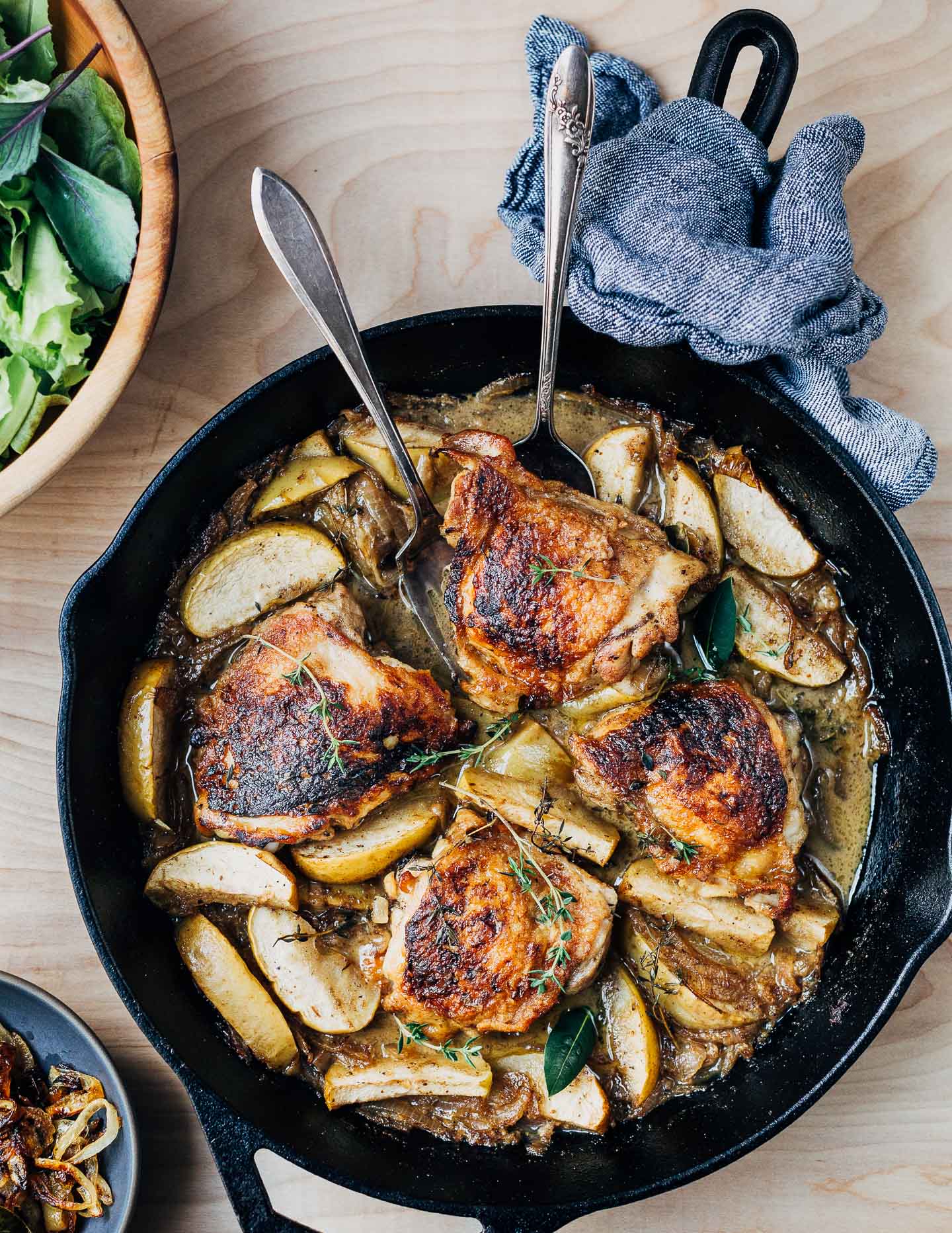 With crisp, golden skin and succulent meat, cider-braised chicken with apples, herbs, and caramelized onions makes for a classic autumn meal.