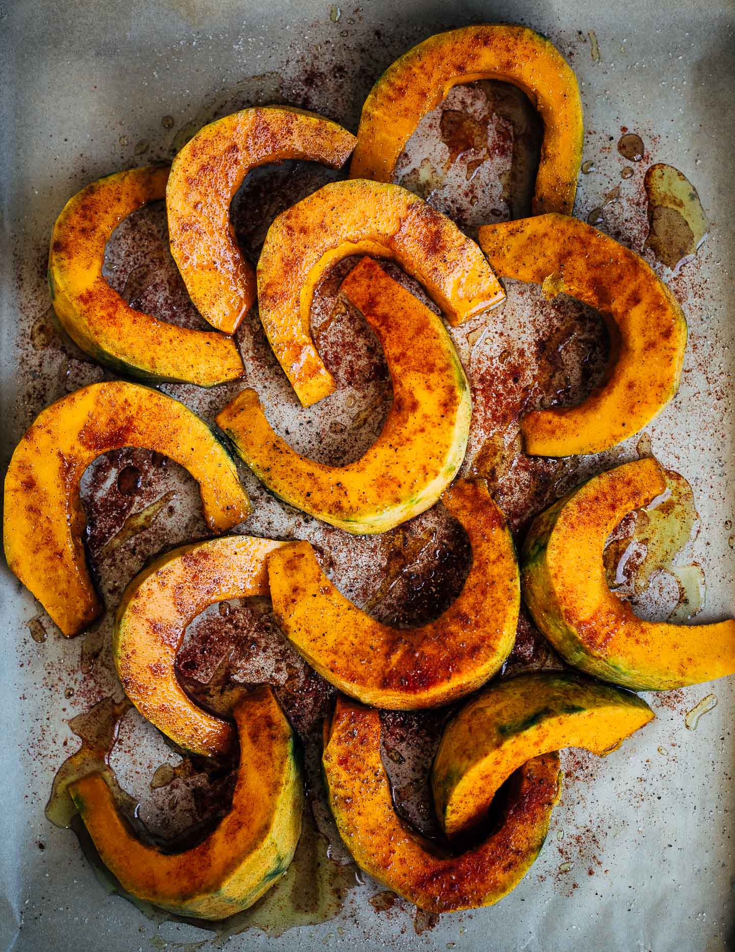 Kabocha squash wedges tossed with maple syrup, EVOO, paprika, and sea salt.