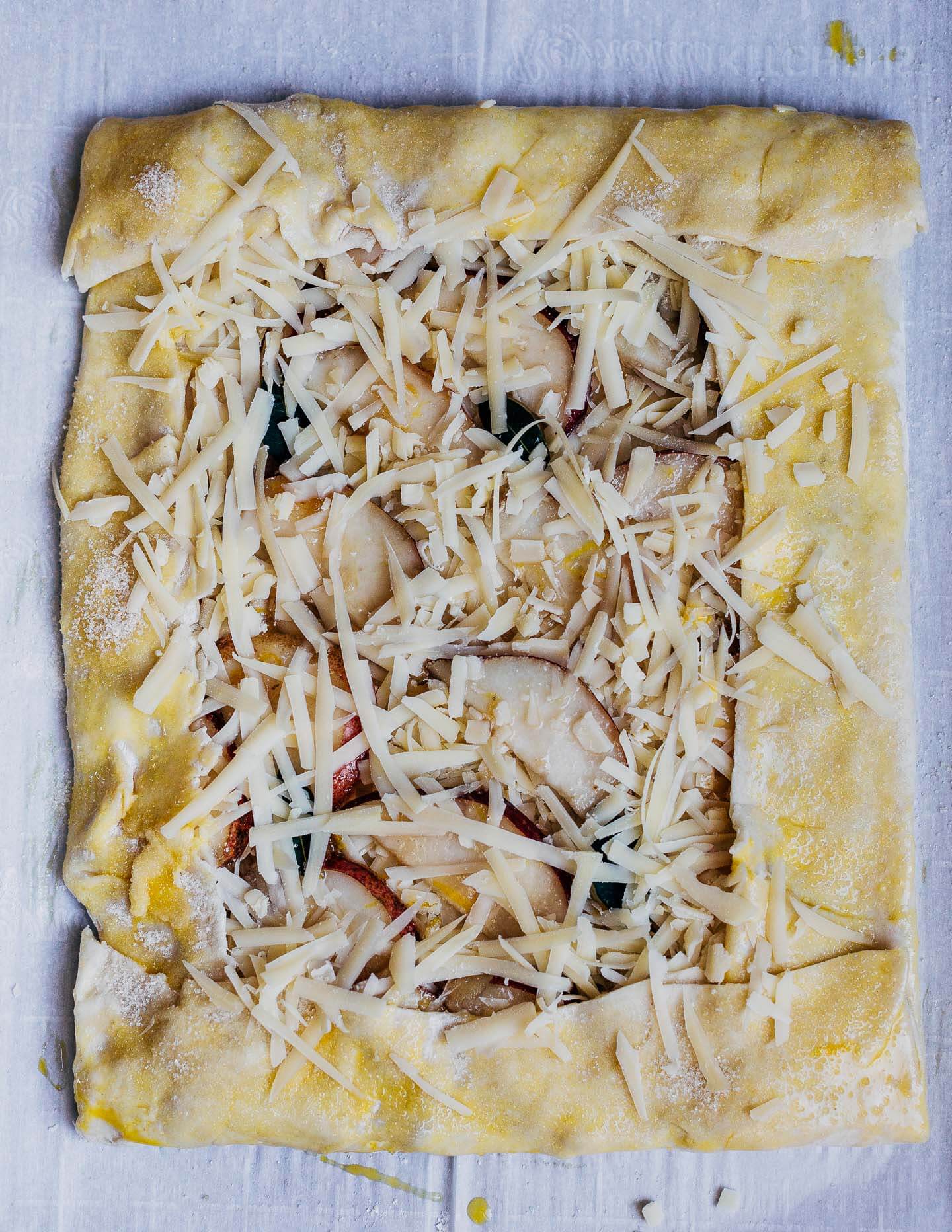 A rustic pear and Gruyere tart, ready for the oven. 