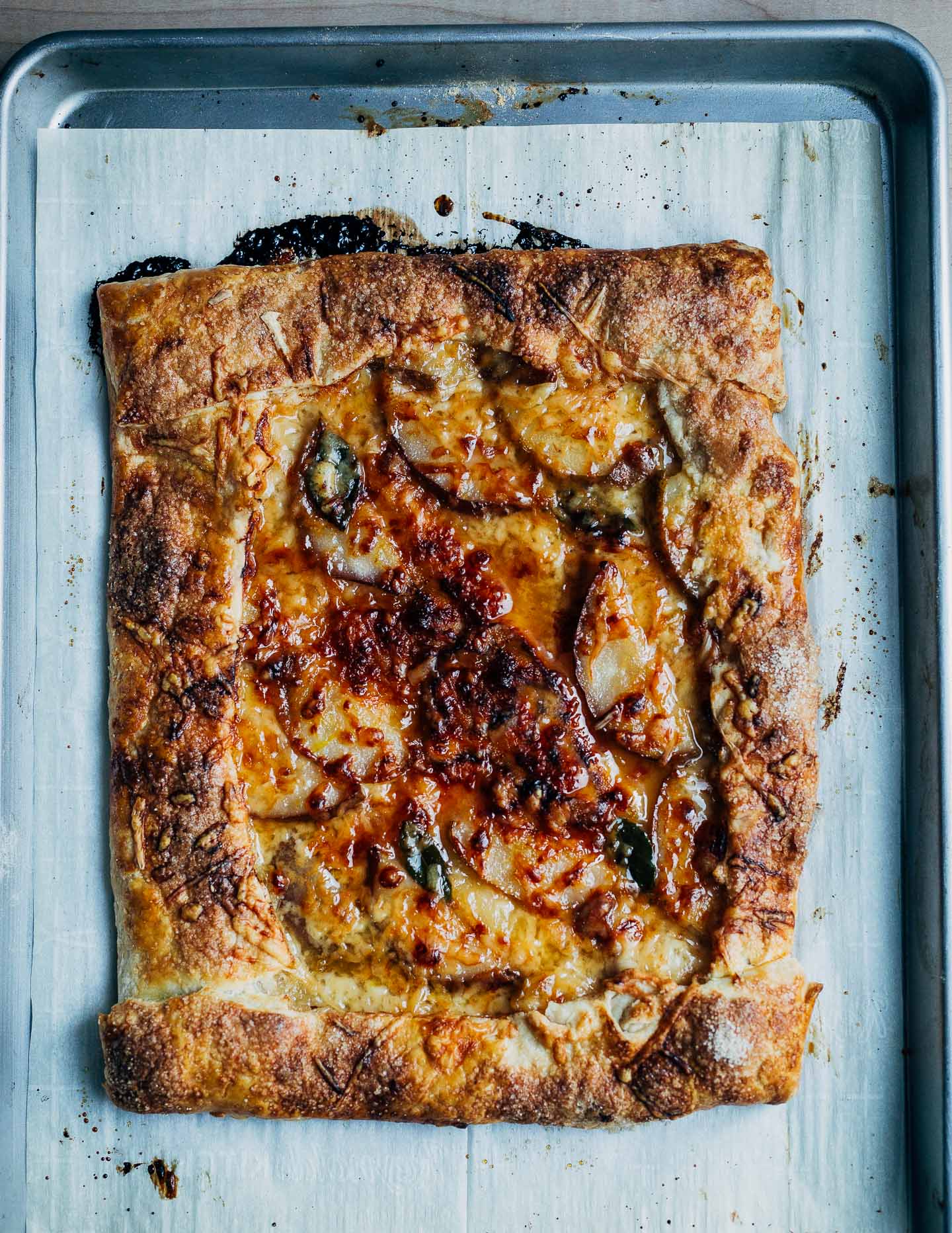 Sweet and a little savory, this rustic pear and Gruyere tart with fresh bay leaves makes for a lovely holiday appetizer. 