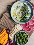 Don't forget the appetizers! This light, tangy whipped goat cheese dip is a lovely addition to a festive holiday snack board. This delicious chèvre dip comes together in minutes and can be made up to 3 days ahead of time.
