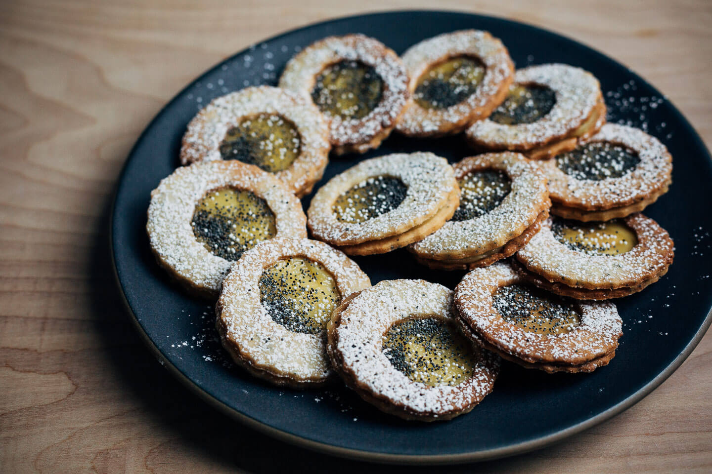 Buttery lemon poppy seed cookies with light, wonderfully bright Meyer lemon curd are a delightful holiday treat.