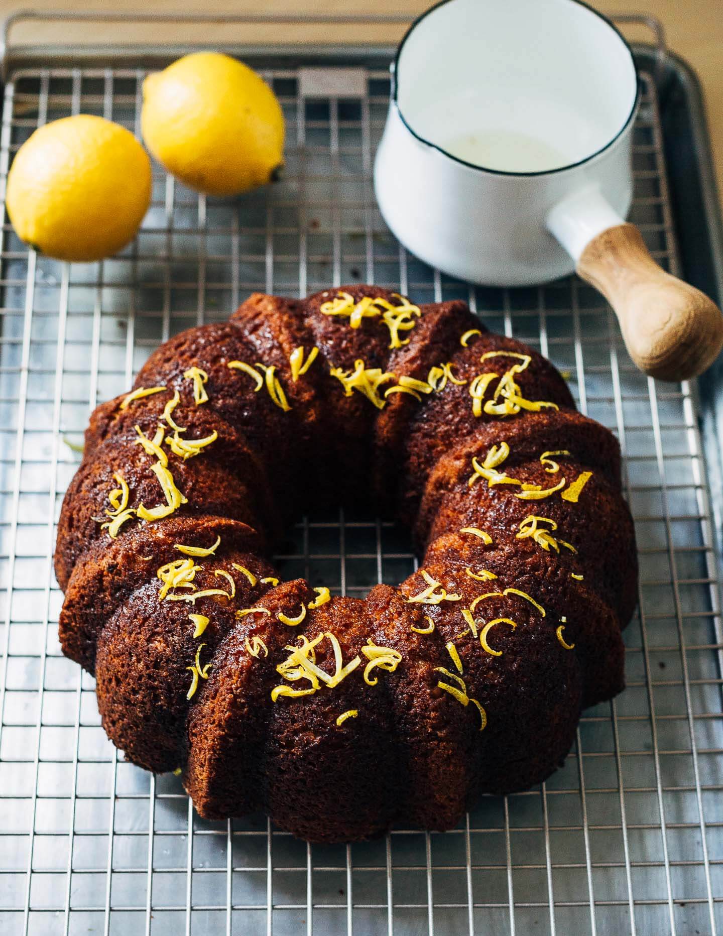 Spelt flour and olive oil lemon bundt cake, just topped with a lemon-sugar glaze.