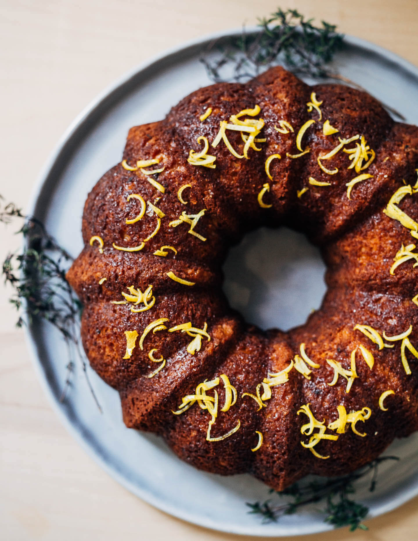 A rustic spelt and olive oil lemon bundt cake with lots of bright lemon flavor and a tender, springy crumb.
