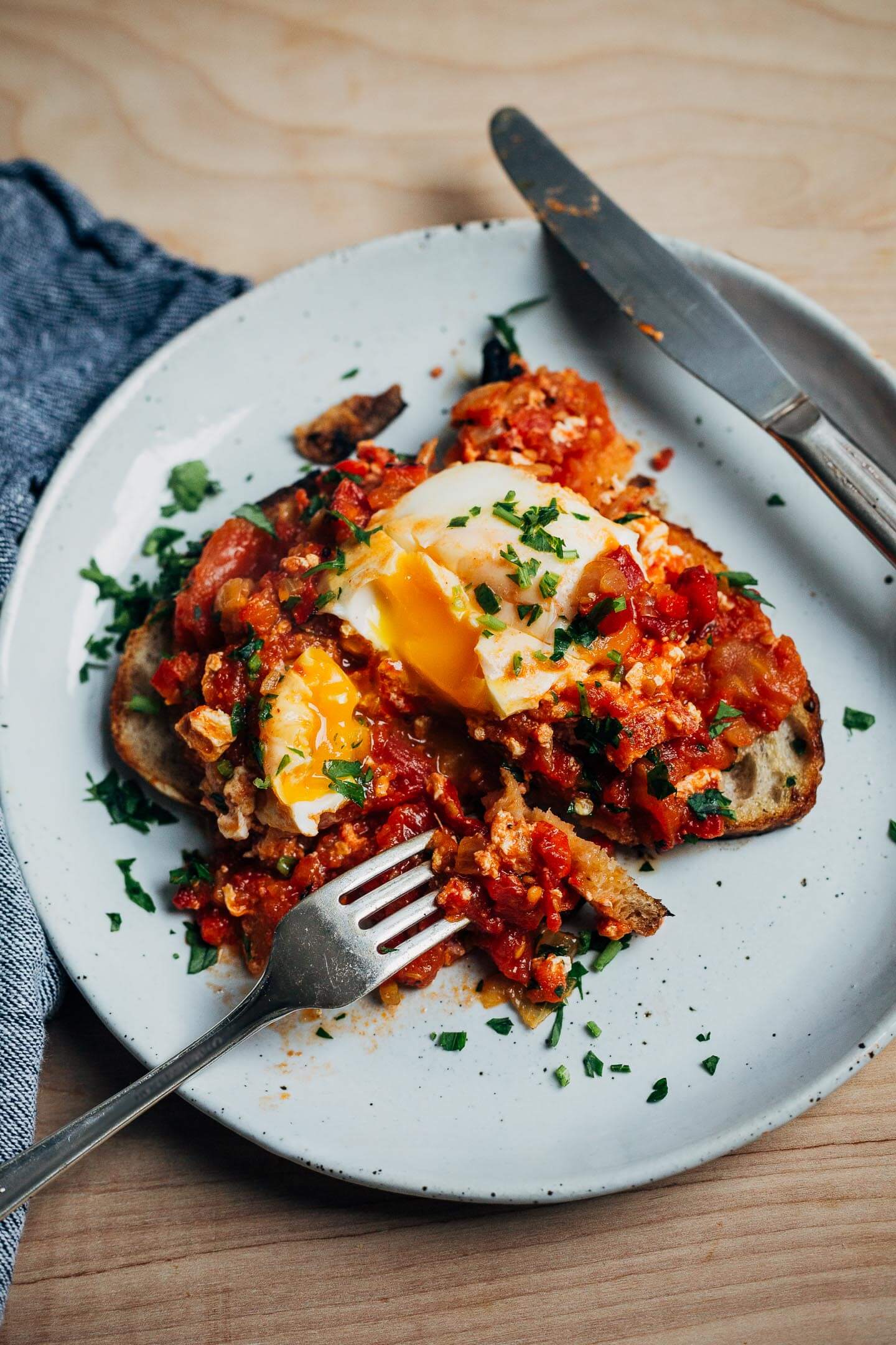 Shashuka on toast with a runny yolk.