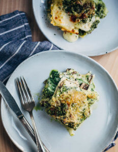 Two plates with slices of kale pesto lasagna