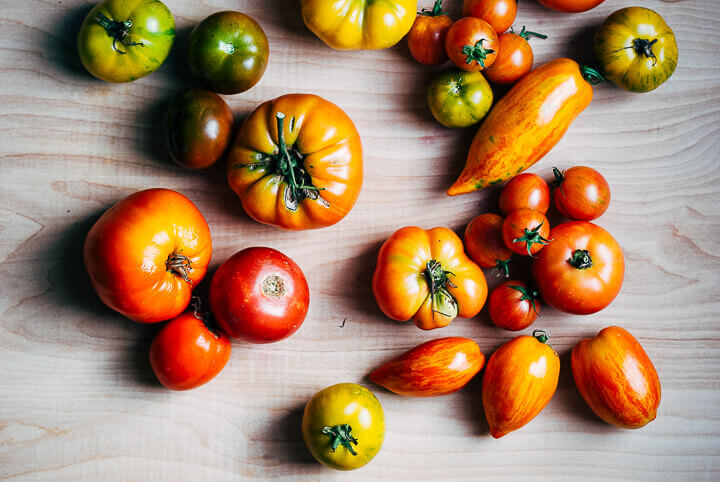 Tomatoes on a table top. 