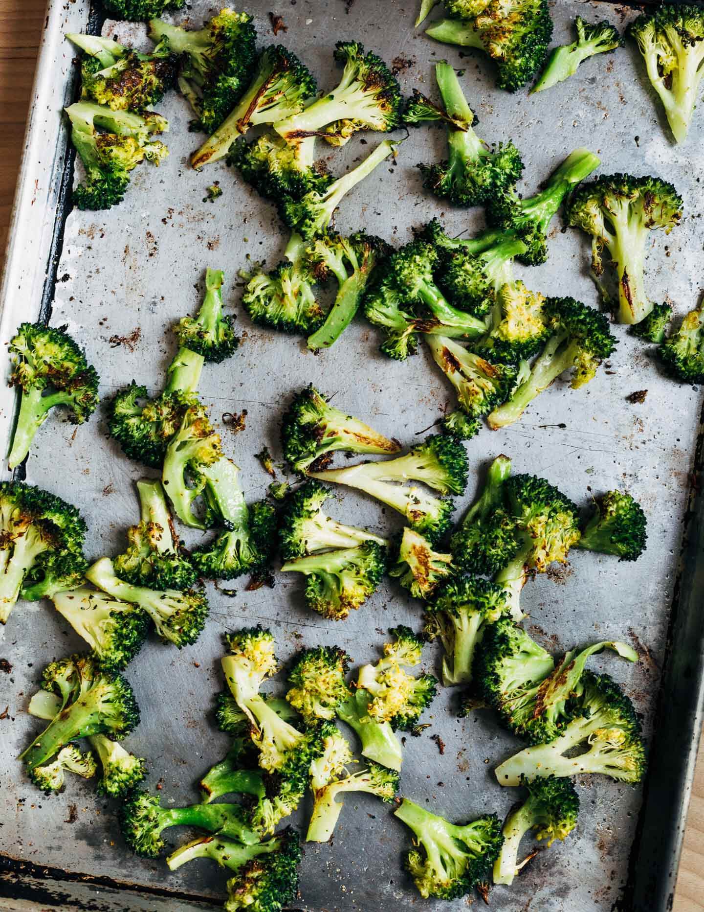A sheet pan with roasted broccoli