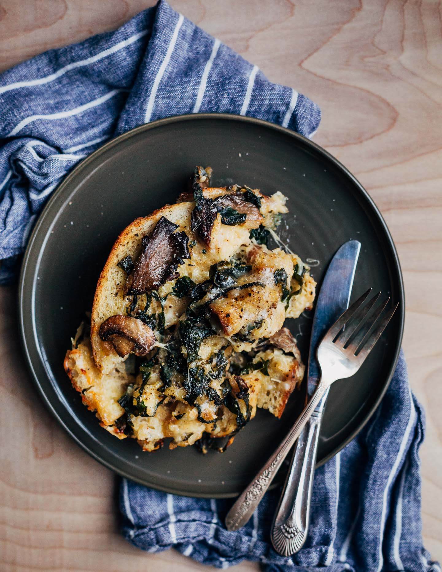 A plate with a serving of savory bread pudding.