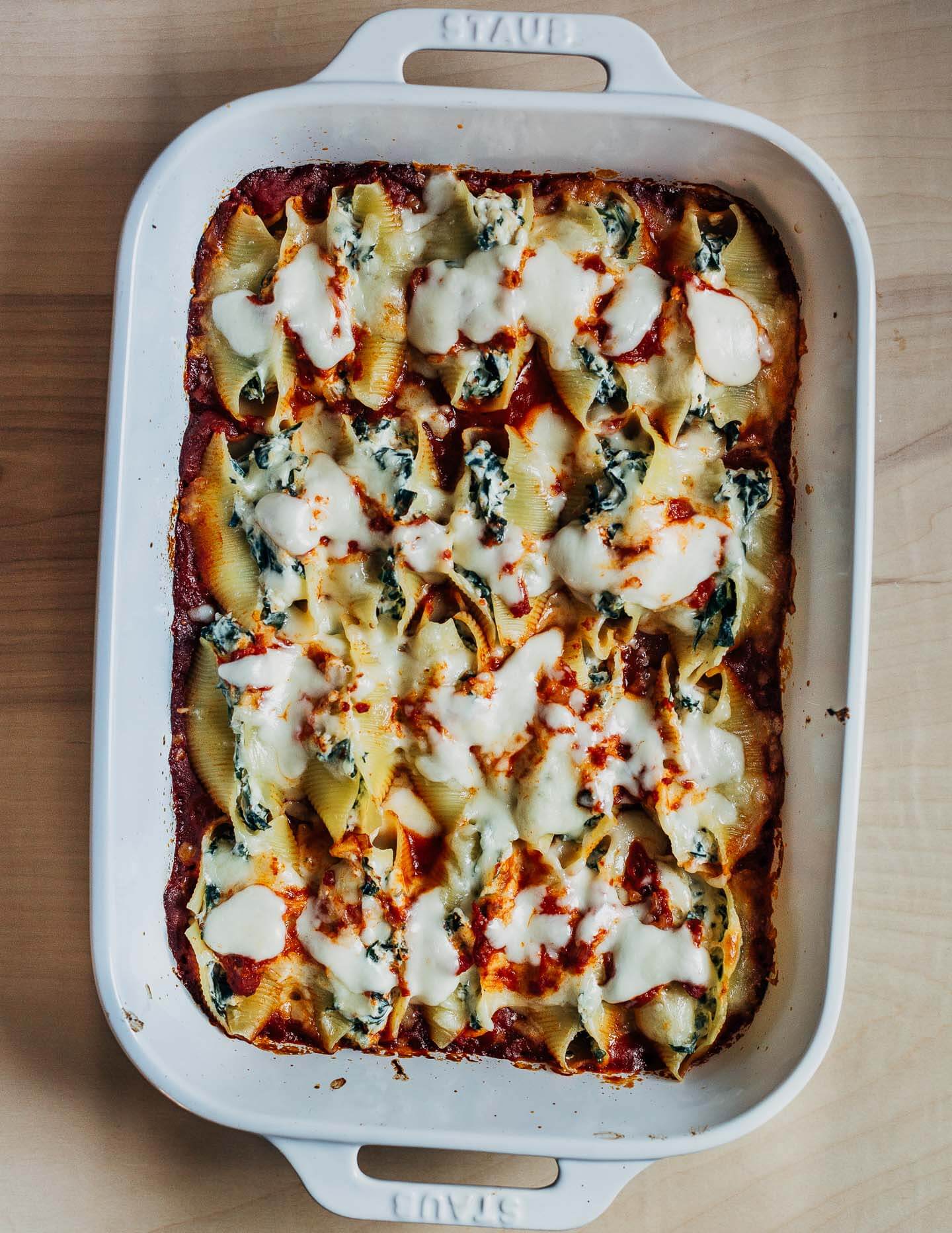 Stuffed shells covered on melted mozzarella, just out of the oven. 