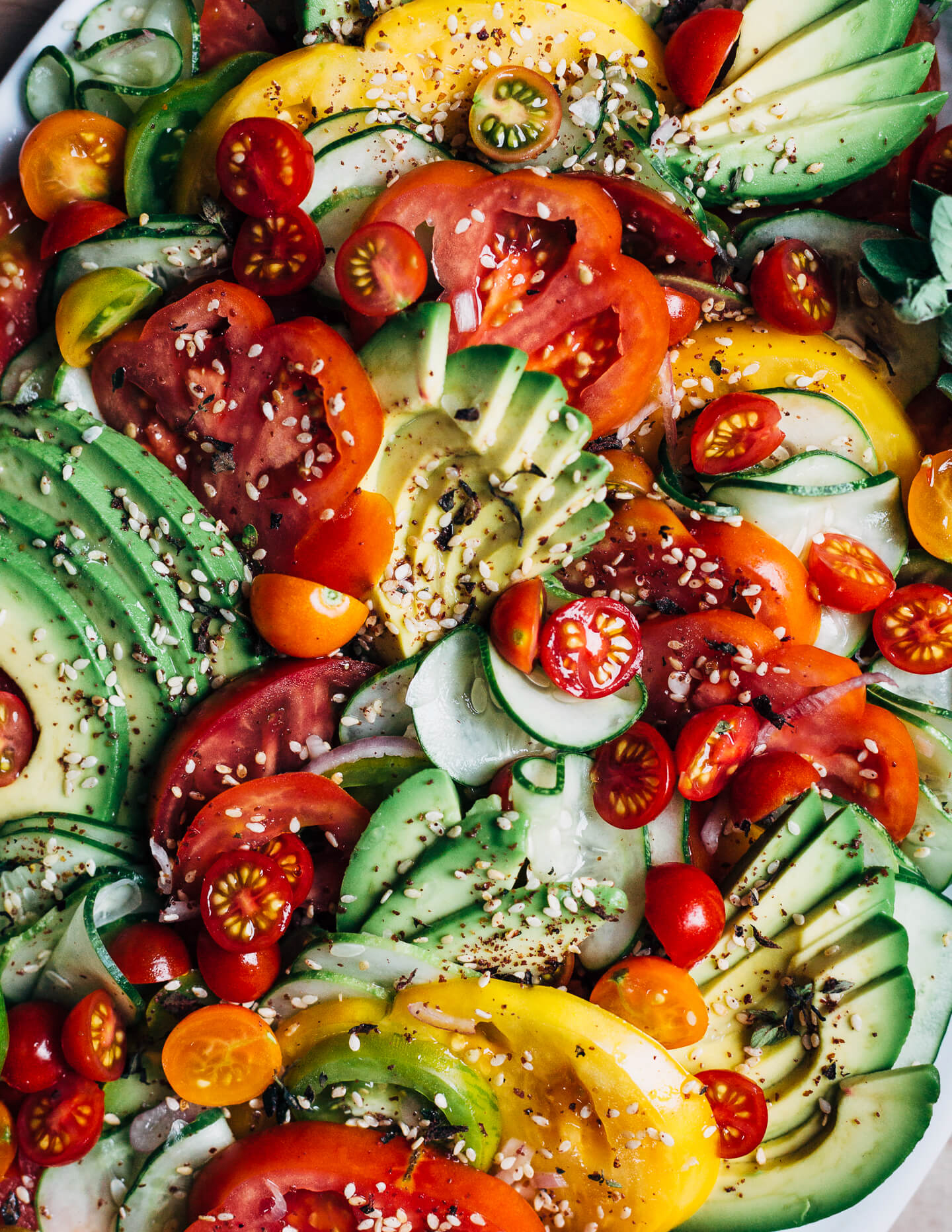 A close view of an avocado and tomato salad.