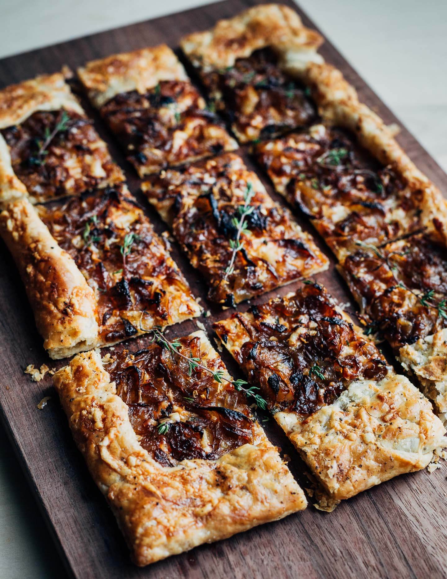 A sliced tart on a cutting board.