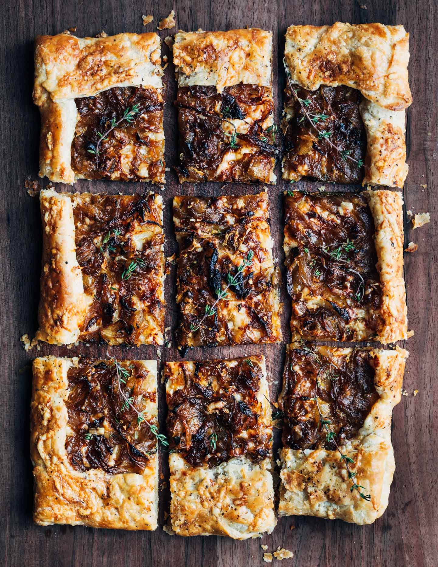 A sliced tart on a cutting board. 