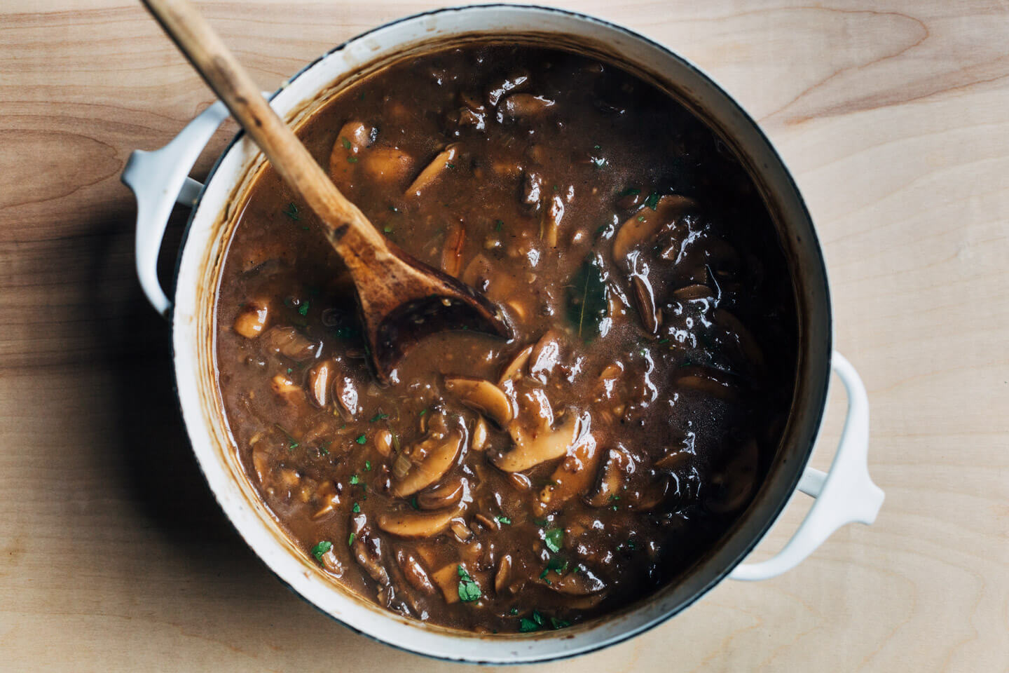 Looking down on a pot of mushroom gravy.