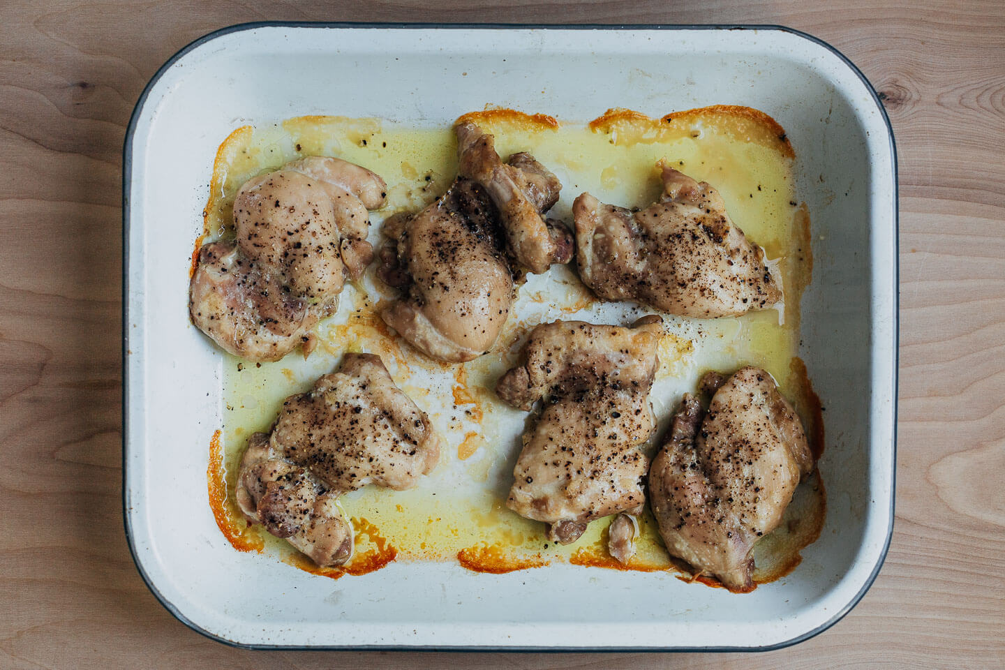 Roasted chicken thighs in a baking dish