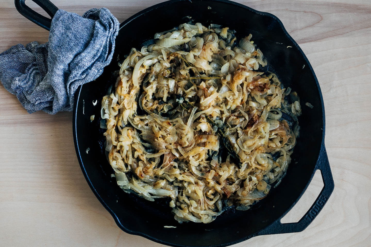 A cast iron skillet with caramelized onions